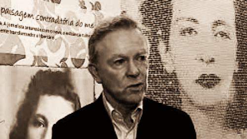 K. David Jackson speaking in front of background images of Patrícia Galvão (Pagu)