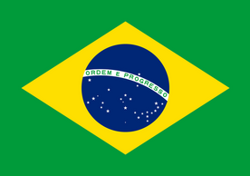 Brazilian flag which consists of green background, large yellow square, navy blue circle in the middle with a few white stars on the bottom of the blue circle. White banner runs across blue circle that says "Ordem e Progresso"